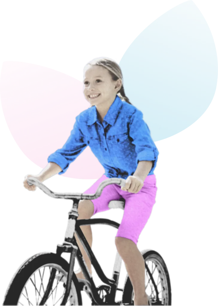 Girl on a bicycle representing the potential and strengths of children supported by Whole Child Collective
